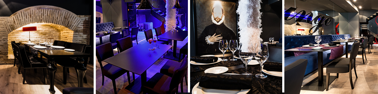 hornacina, mesas negras, sillones azul marino, boa blanca, cuadro El Greco, restaurante con manteles, copas, platos, servilletas